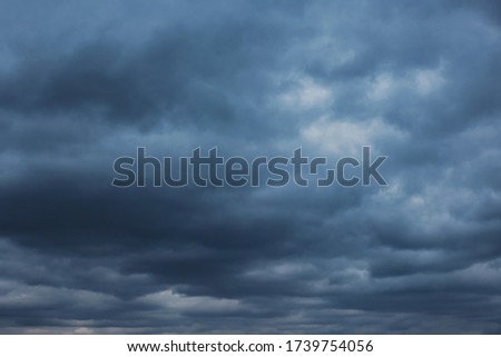 Autumn dramatic cloudy sky background. Panoramic view with beautiful clouds. Horizontal cloudscape. High-resolution photography. Design element. Selective focus. Copy space. 