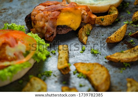 Burger ingredients isolated on rustic background.