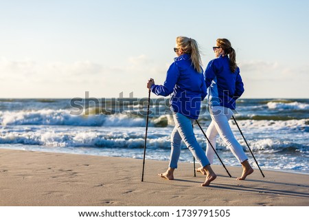 Nordic walking - two women working out on beach
 Royalty-Free Stock Photo #1739791505