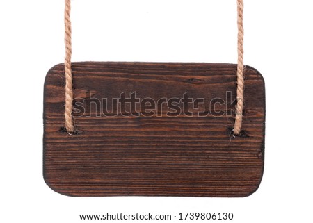 Wooden signpost is hanging on two ropes. Isolated on a white background. Copy space