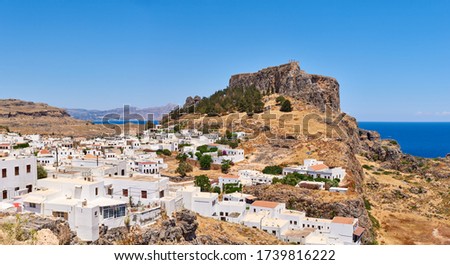 Panoramic view of Lindos village with the Acropolis on the hill. Rhodes, island, Greece
