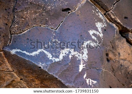A wavy line seems illustrates a snake at La Cieneguilla petroglyphs near Santa Fe, NM