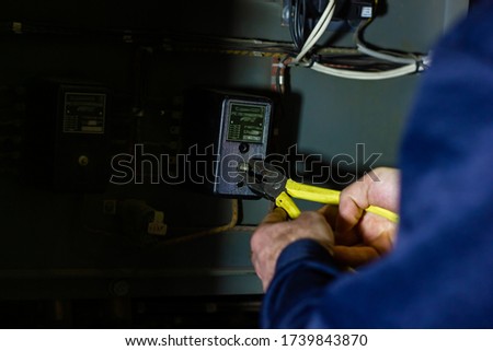 technician at work, technician repairing electricity