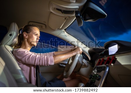 Young female driver at the wheel of her car - Road safety concept Royalty-Free Stock Photo #1739882492