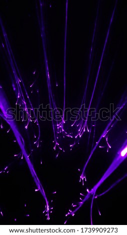 Overlaying wavy lines forming an abstract pattern on a dark background.