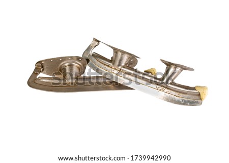 old steel skates isolated on a white background Hockey puck Figure skating sport
