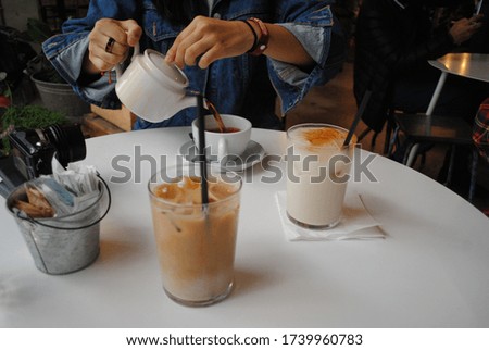 This pleasant picture shows a table with coffee and tea.