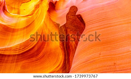 Thumbs Up. A thumb shape carved by erosion in the smooth curved Red Navajo Sandstone walls of Owl Canyon, one of the famous Slot Canyons in the Navajo lands near Page Arizona, United States