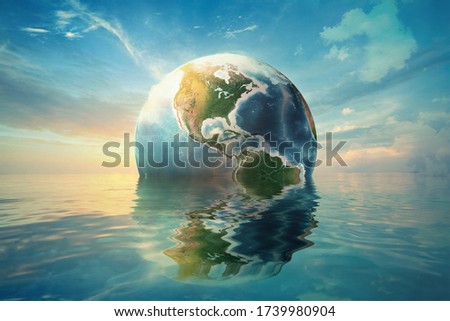 Planet Earth is floating over the ocean ... Sea Freight, Global warming, Travel Concept