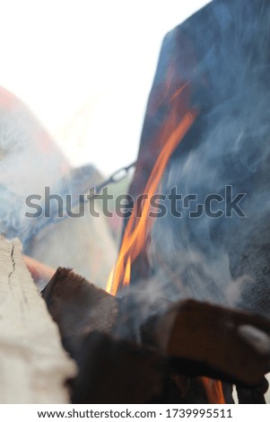 Firewood is burning in the barbecue grill. Flaming Charcoal Grill With Close up.