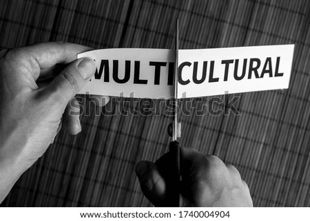 multicultural is cut with scissors, concept, black and white photo