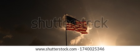American flag at sunrise. Beautiful background for congratulations on Independence Day. Happy 4th of July in USA.