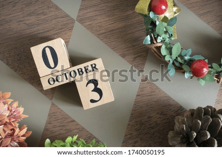 October 3, Date design with number cube.