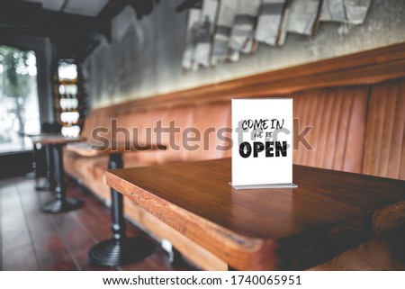 Come in we're open  in cafe owner open startup with cafe shop