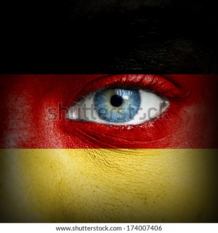 Human face painted with flag of Germany