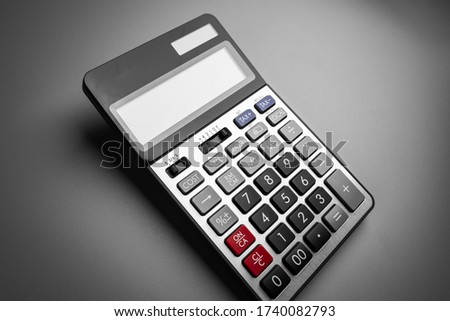 calculator on a gray background.