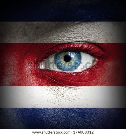 Human face painted with flag of Costa Rica