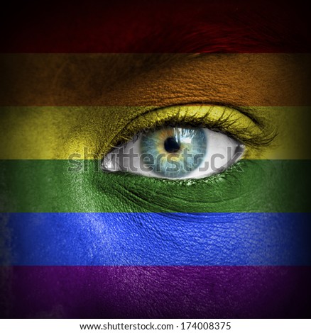 Human face painted with flag of LGBT