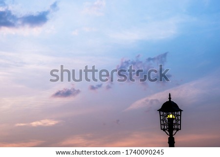 Lamp and golden light sky during the evening sunset view.