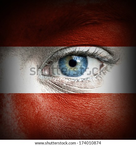 Human face painted with flag of Austria