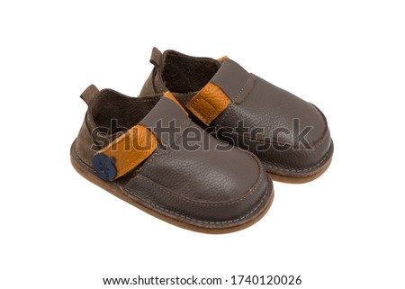 genuine leather baby shoes, isolated on white background, stock photography