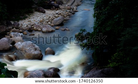 Picture atop of small waterfall during dusk 