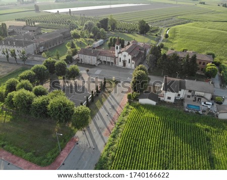 Aerial view of a small town in northern Italy on a summer day.