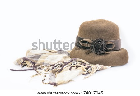 female brown hat and checkered scarf