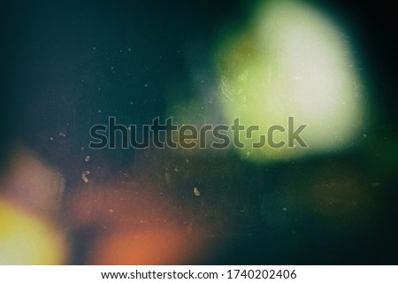 Film Strip Texture with Scratch and Grain Background with Light Leak, Suitable for Overlay and Color Cast Effect. Royalty-Free Stock Photo #1740202406