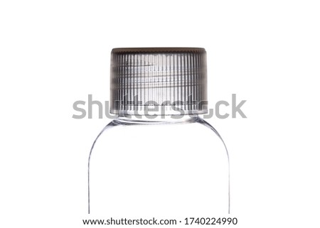 Plastic cap on a transparent plastic bottle for toilet liquid
