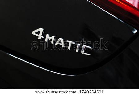 4matic icon on a black modern car, all-wheel drive car concept