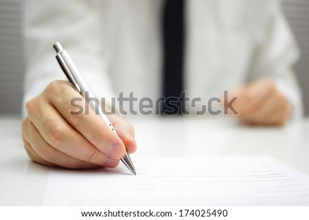 businessman is signing contract