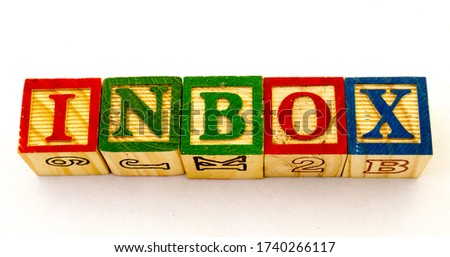 The phrase inbox visually displayed on a clear background using colorful wooden toy blocks image with copy space in horizontal format