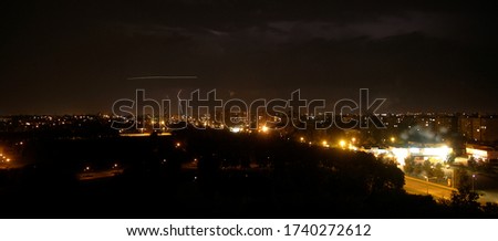 Lightning strikes down over the city at night. Long Exposure Photography. Lithuania Kaunas 