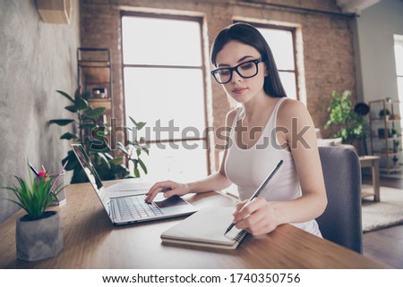 profile side photo of focused assistant girl work remote laptop have online seminar meeting boss write tips copybook star-up progress presentation sit desktop chair in comfy home office house