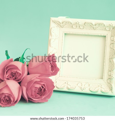 White vintage frame and roses