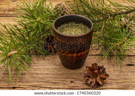 Pine needle tea, sollip-cha, traditional Korean beverage. Alternative medicine, healthy life style. Vintage wooden boards background Royalty-Free Stock Photo #1740360320