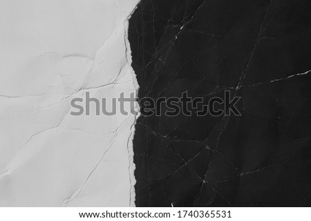OLd black and white torn paper texture. Grunge background