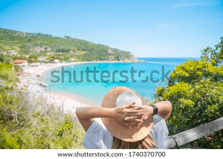 Female with straw beach hat on mediterranean sea coast background. Summertime banner. Meditation and relax. Vacation and tourism concept. 