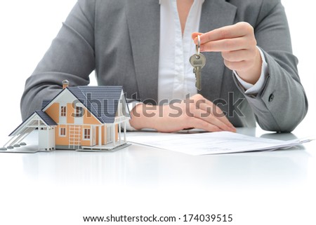 Woman signs purchase agreement for a  house