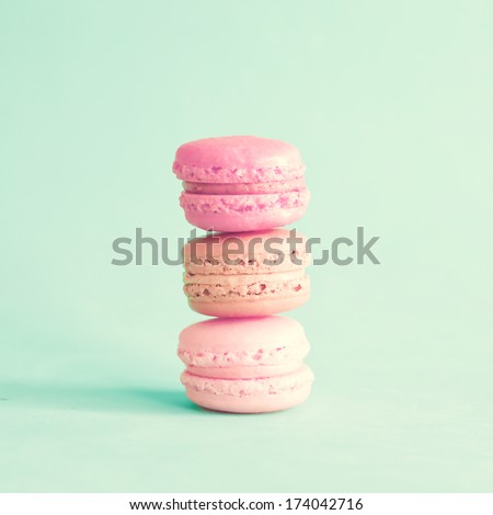 Sweet and colourful french macaroons on retro-vintage background 