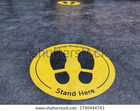 Standing marker for social distancing to avoid spreading coronavirus ( Covid-19 ). Location or distance concept. Idea for COVID-19 outbreak. Royalty-Free Stock Photo #1740444743