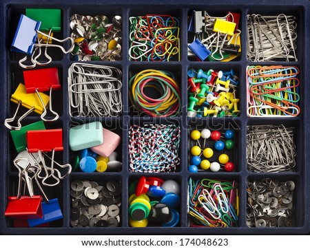 stationery collection in black box surface top view  Royalty-Free Stock Photo #174048623