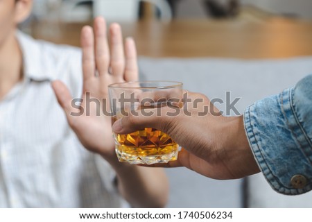 Stop alcohol concept. Person refuse to drink alcohol. Royalty-Free Stock Photo #1740506234