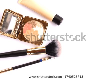 Cosmetic products with a mirror on a white background