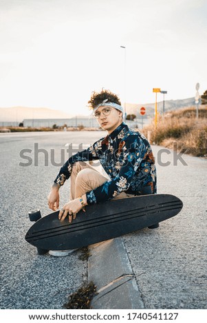 Young Man Longboarding in the Street. Guy skateboard