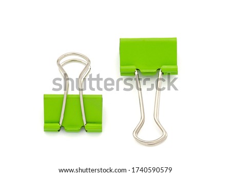 Green paper clip isolated on white. Clipping path