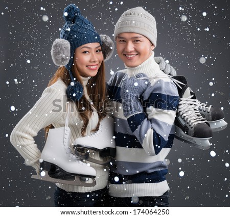 Portrait of a couple of figure skaters smiling and looking at camera 