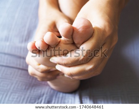 Symptom foot pain and numbness in feet of adult women or ache from bunion disease or plantar fasciitis.
