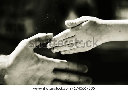 Photo of child holidng out his hand